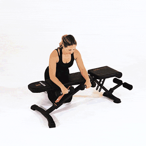 Palms-Down Dumbbell Wrist Curl Over a Bench