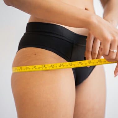 Woman standing on a scale