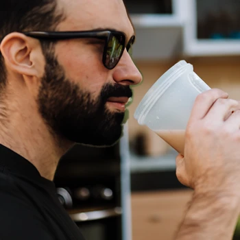 man drinking whey protein drink