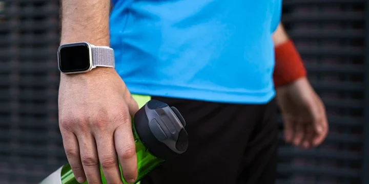 A close up shot of a man wearing the best fitness tracker for CrossFit