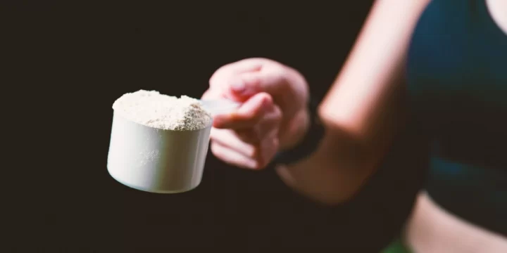 A woman scooping powder