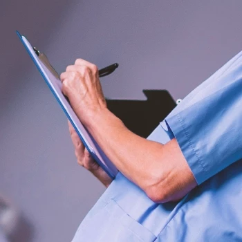 A nurse writing Burn Lab Pro Side Effects