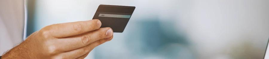 A person holding a credit card