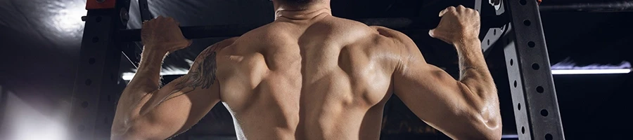 A close up shot of a man doing pull-ups