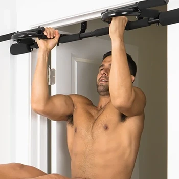 A man using pull-up bar at home
