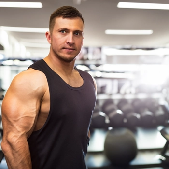 man lifting weights at the gym