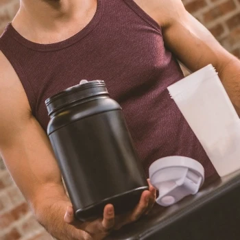 A man preparing a Protein Powder shake