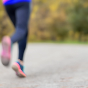A close up shot of a runner on a road