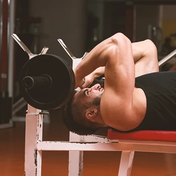 A man performing skull crusher