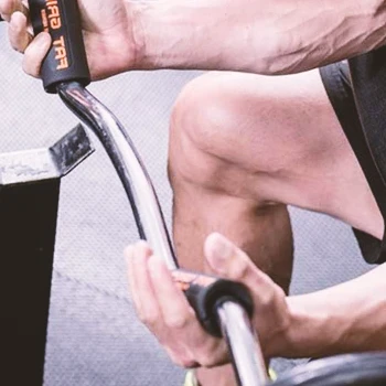 Man using thick barbell to train forearms
