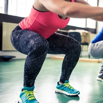 A woman doing squats