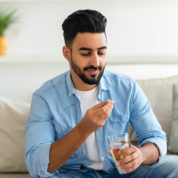 Man Taking Instant Knockout supplement product